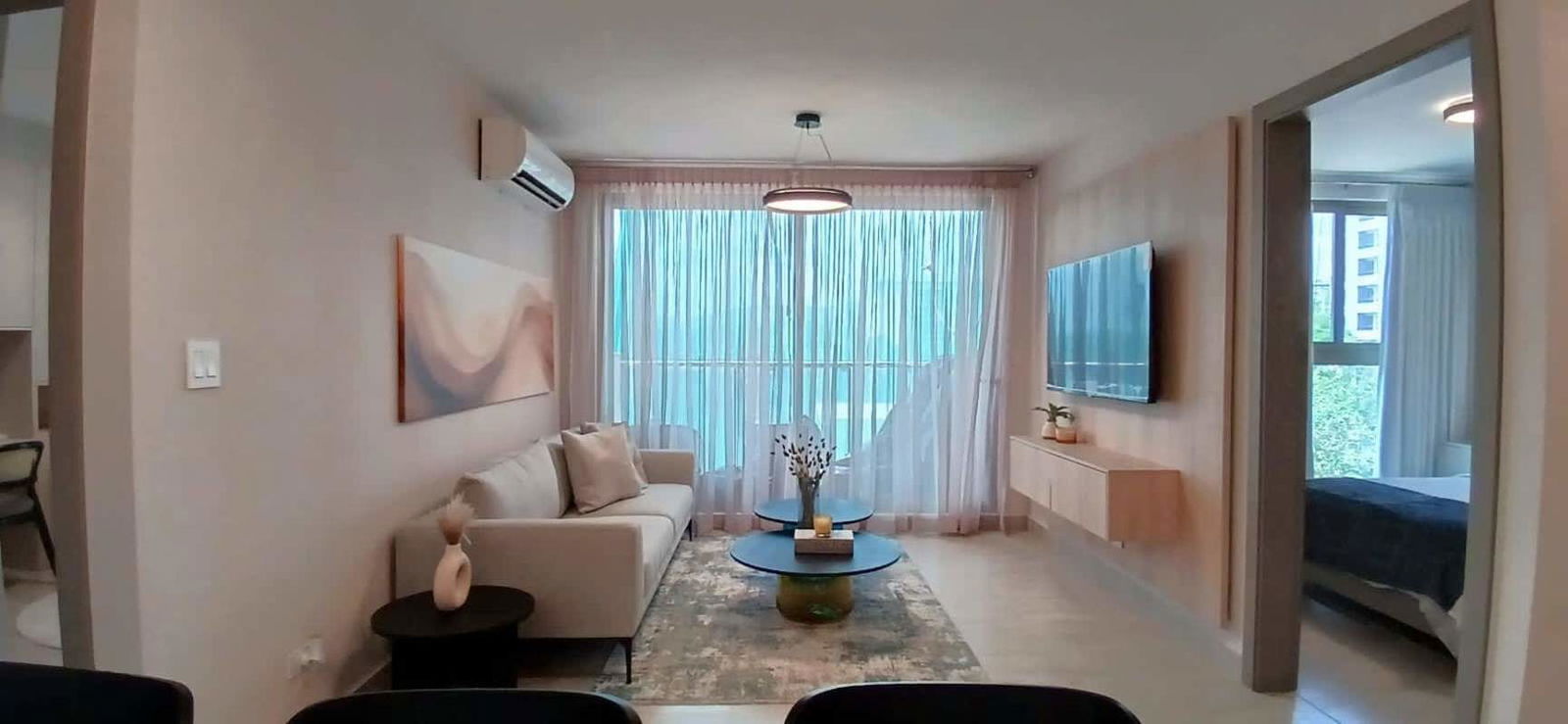 Modern open kitchen with granite countertop and cabinetry in new Panama Pacifico apartment