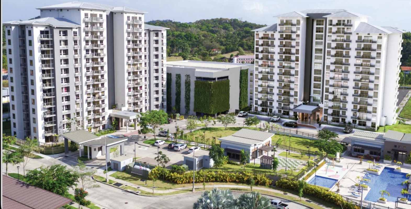 Aerial shot of PH Parterre towers, swimming pools, playground and landscaped gardens in Panama Pacifico
