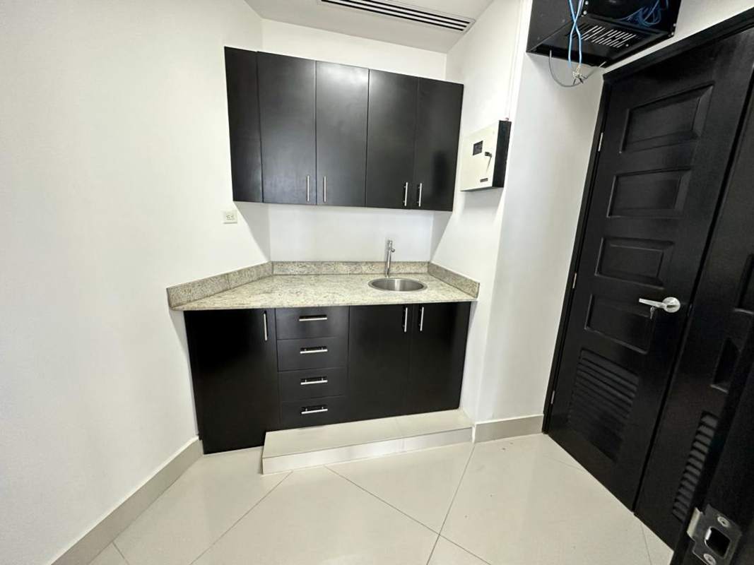 Compact kitchenette granite countertop in commercial office F&F Tower Panama