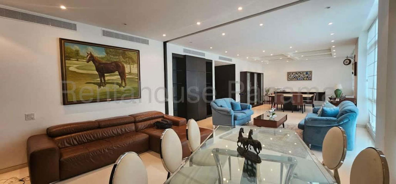 Luxury lounge area with leather sofas, recessed lights oceanfront apartment Punta Pacifica Panama