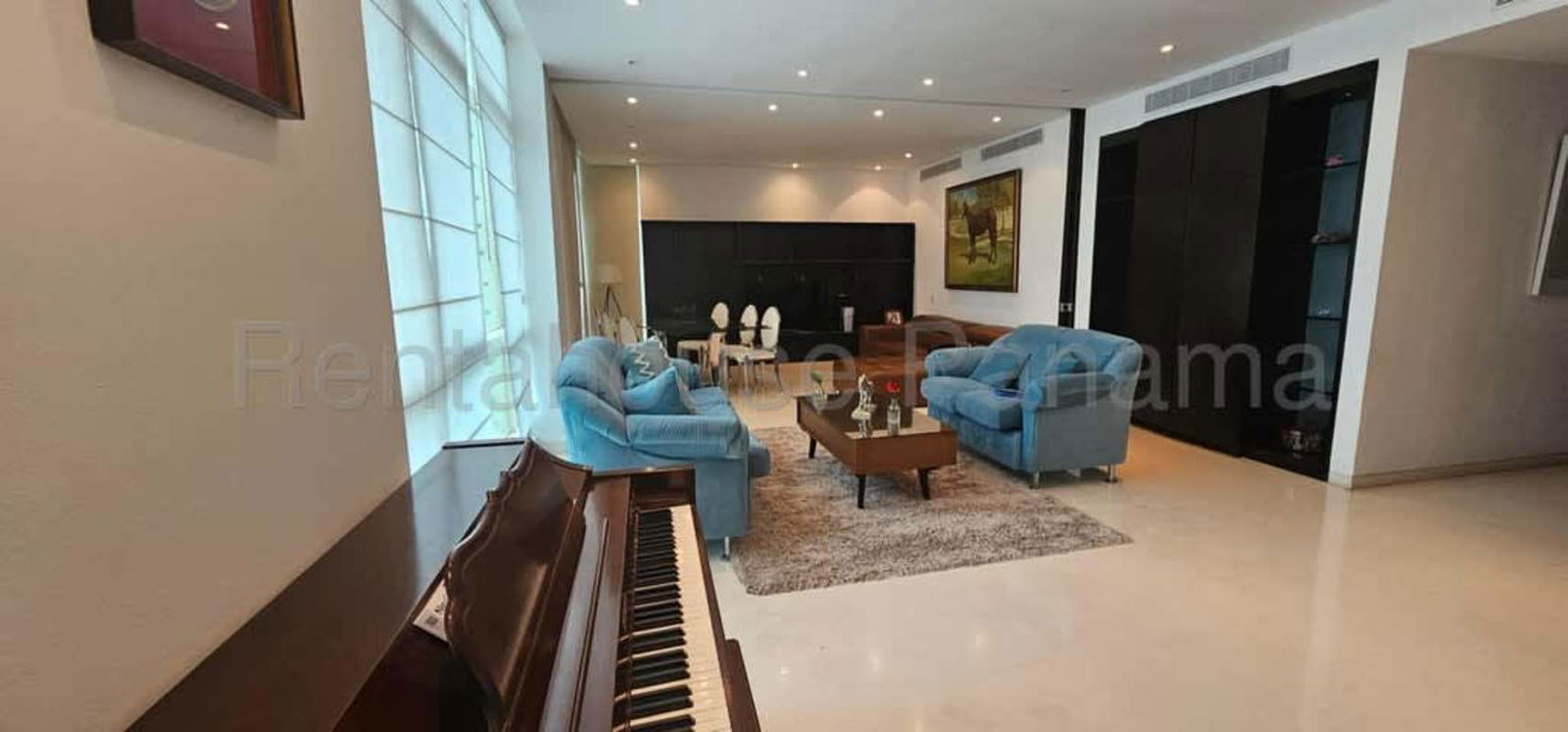 Open-concept luxury living and dining with panoramic windows ocean view at PH Pacific Point Panama