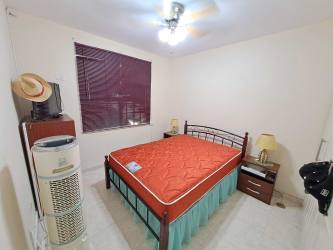 Bathroom featuring vanity sink, wall cabinet, and glass shower