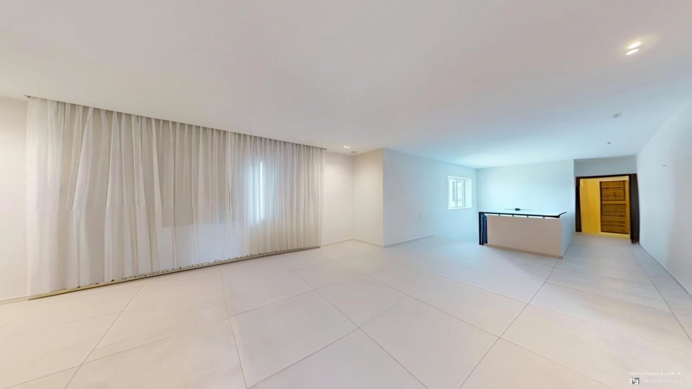 Modern luxury bathroom with double sinks glass shower at The Woods Santa Maria