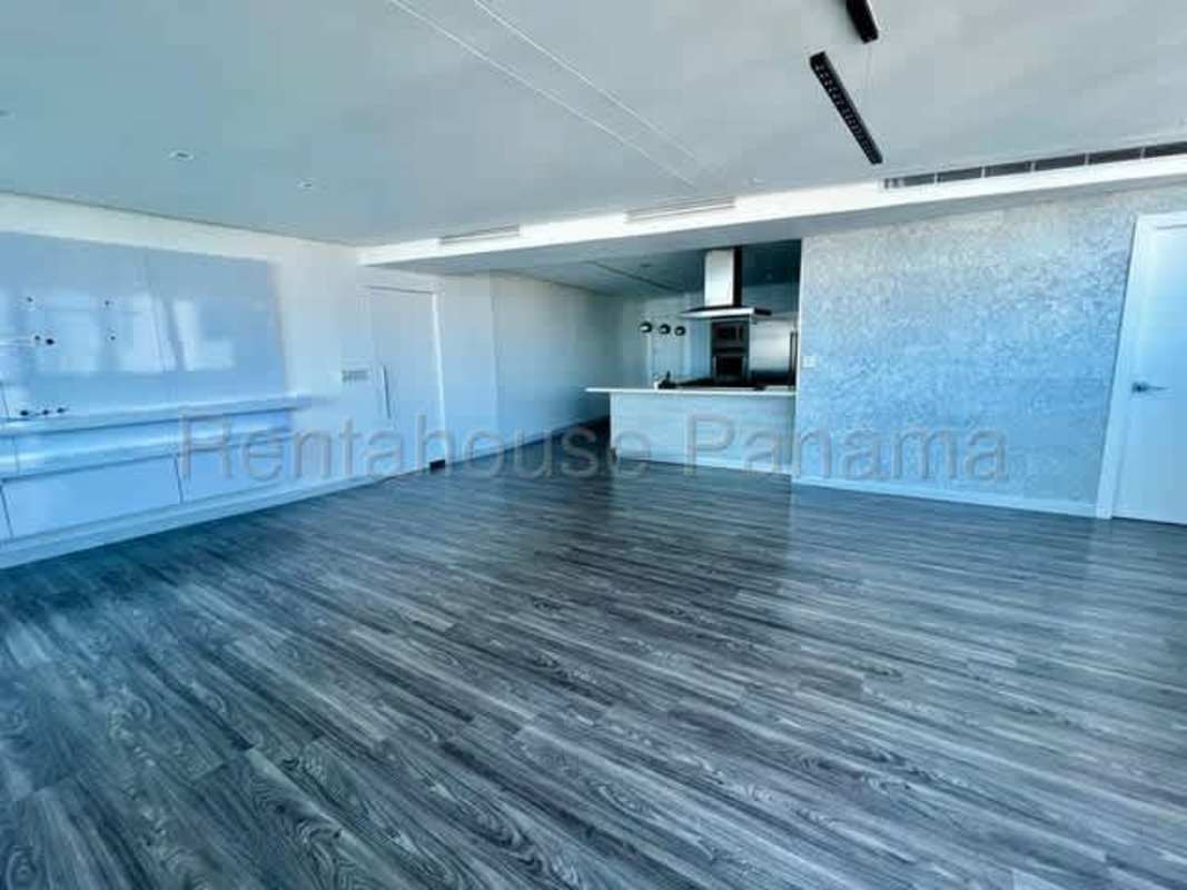 Bedroom featuring windows with ocean and skyline views at PH Joy Tower San Francisco Panama