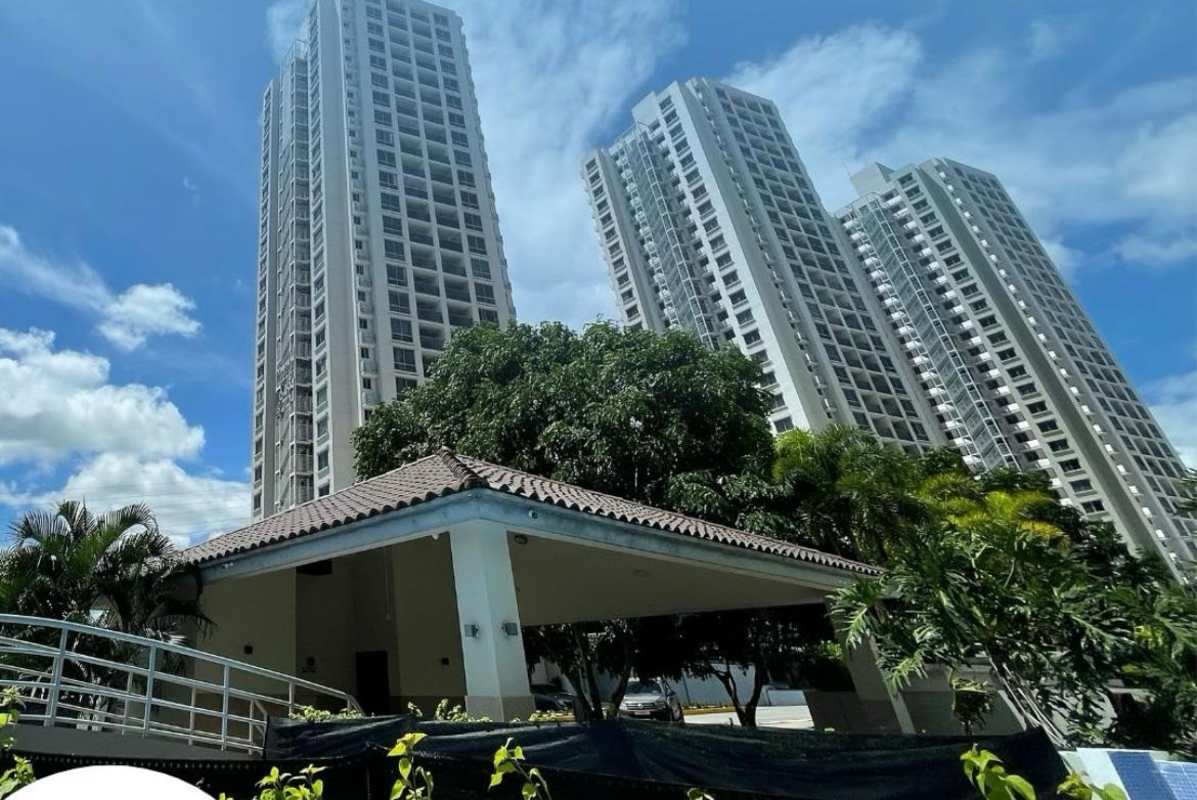 Bright living area with large window and balcony in PH Rokas apartment Pedregal Panama