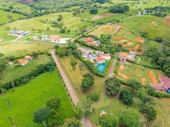 Large estate with houses, swimming pool and green fields aerial in Hacienda Santa Domenica Capira Panama