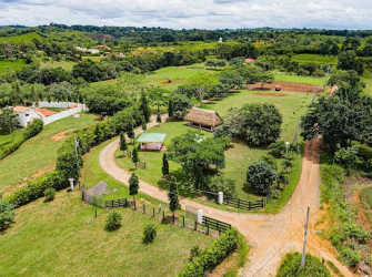 Aerial countryside estate view with farmland, trees, and structures in Hacienda Santa Domenica Capira Panama