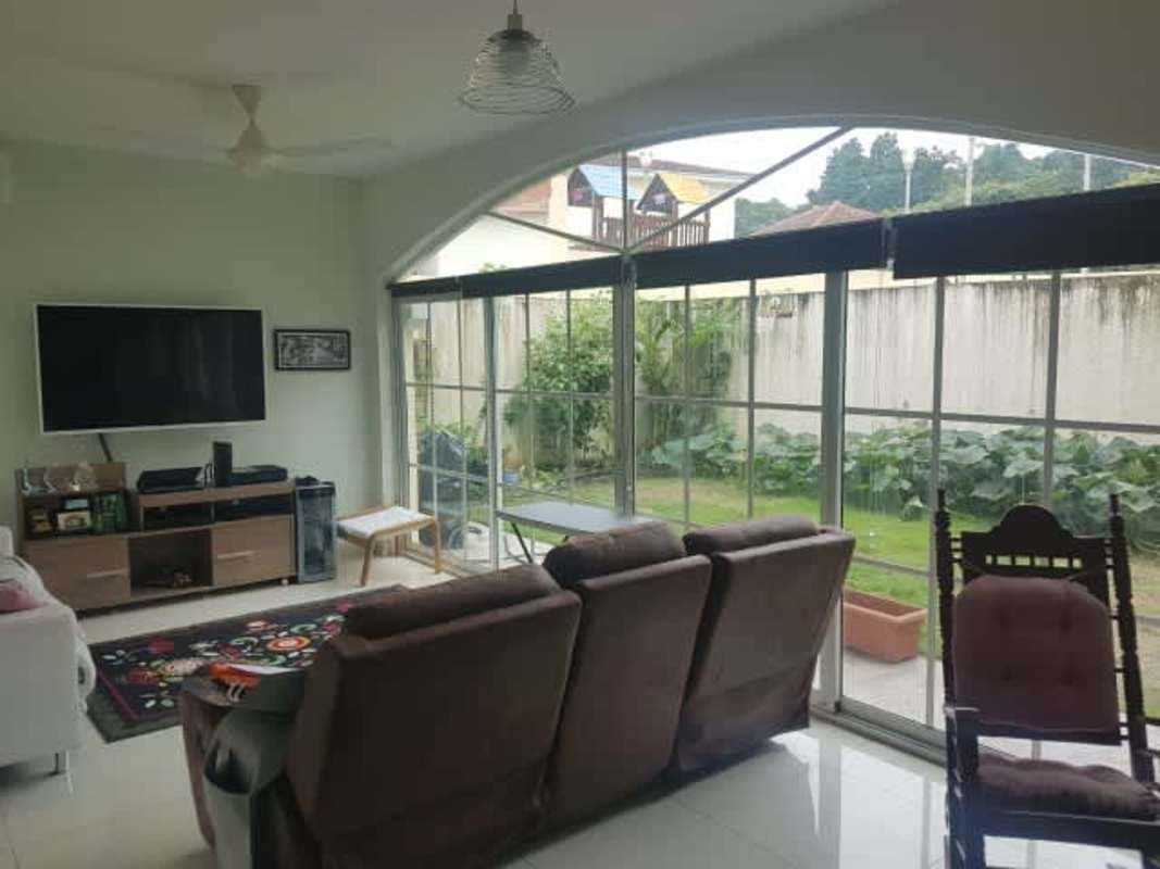Spacious living room with large windows, sliding glass doors, garden view in Clayton Panama