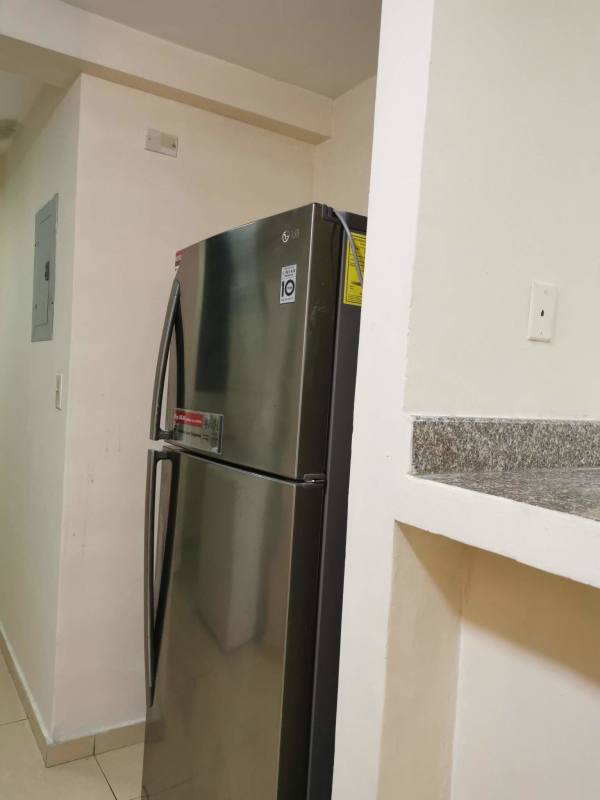 Kitchen with granite counters, appliances, ceramic tile backsplash in PH Terrazas del Rey Condado del Rey Panama
