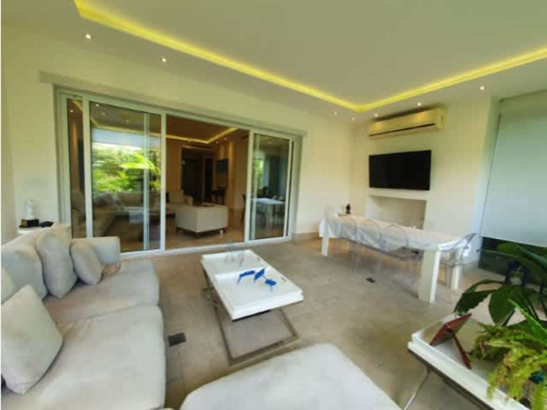 Modern living dining space connected to enclosed terrace garden view The Reserve