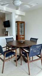 Kitchen with white cabinetry and stainless appliances at PH Casa Bonita Playa Bonita Panama