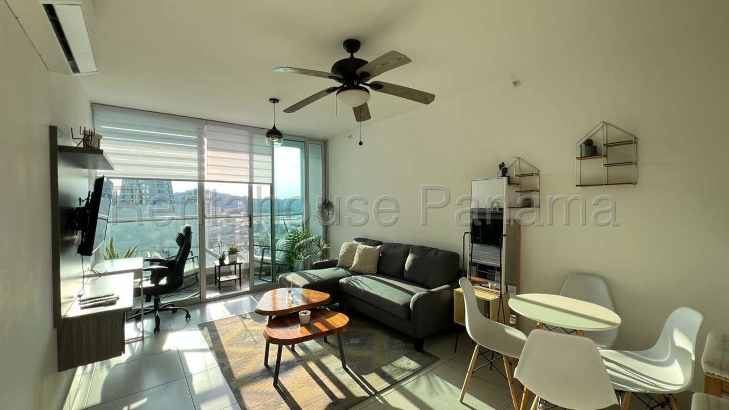 Comfortable furnished bedroom with wardrobe, window and city view PH Vivendi Green Edison Park Panama City