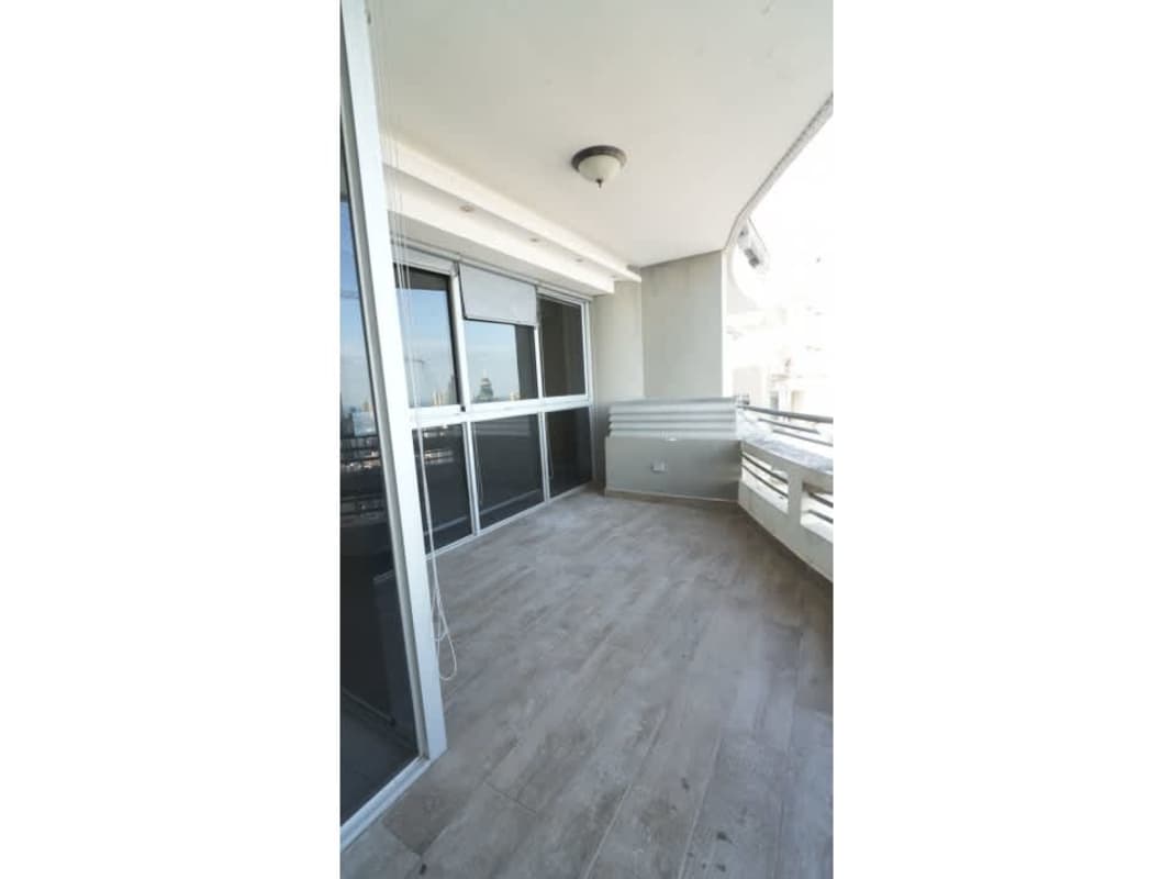 Gourmet kitchen with granite countertops and skyline view in PH Luxor Bella Vista