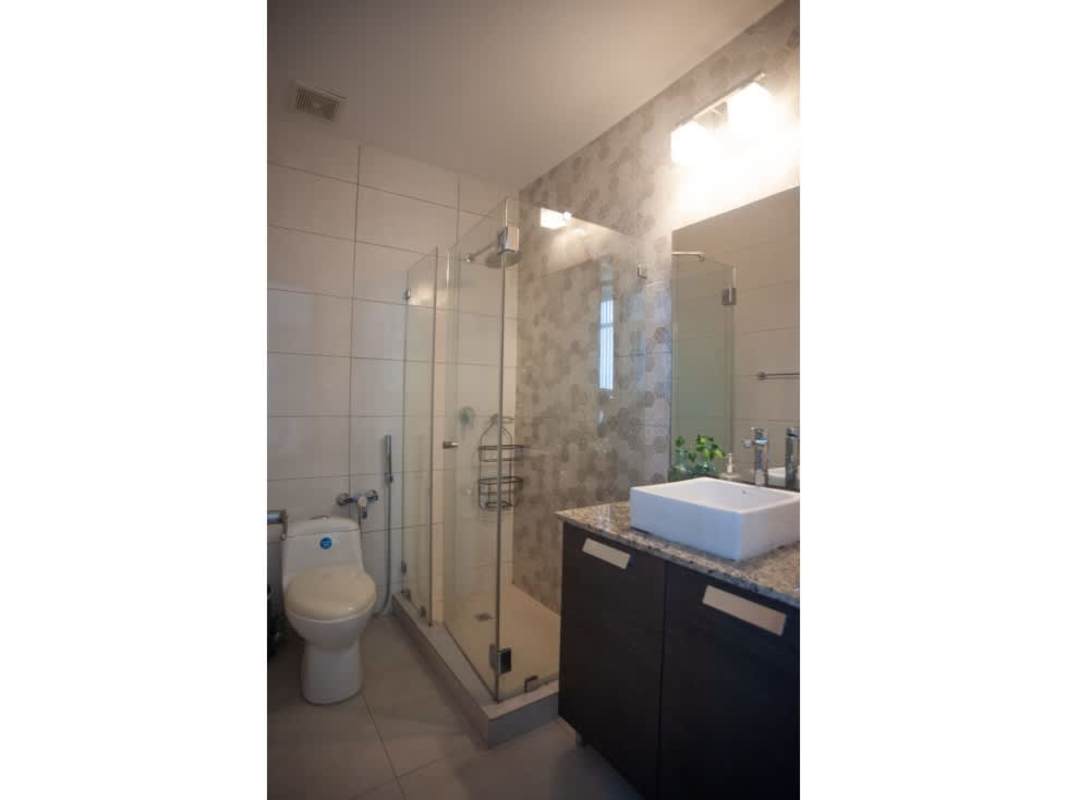 Balcony with safety net city skyline view high-rise apartment PH Luxor Panama