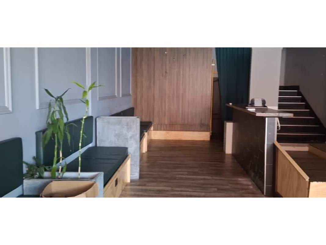 Lobby reception with wood accents booth seating modern stairs in San Francisco Panama commercial space