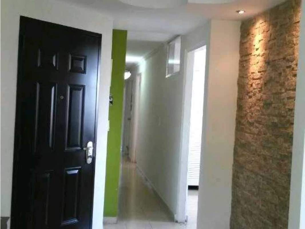 Kitchen with wood cabinetry, granite counters, pass-through window PH Hato Pintado