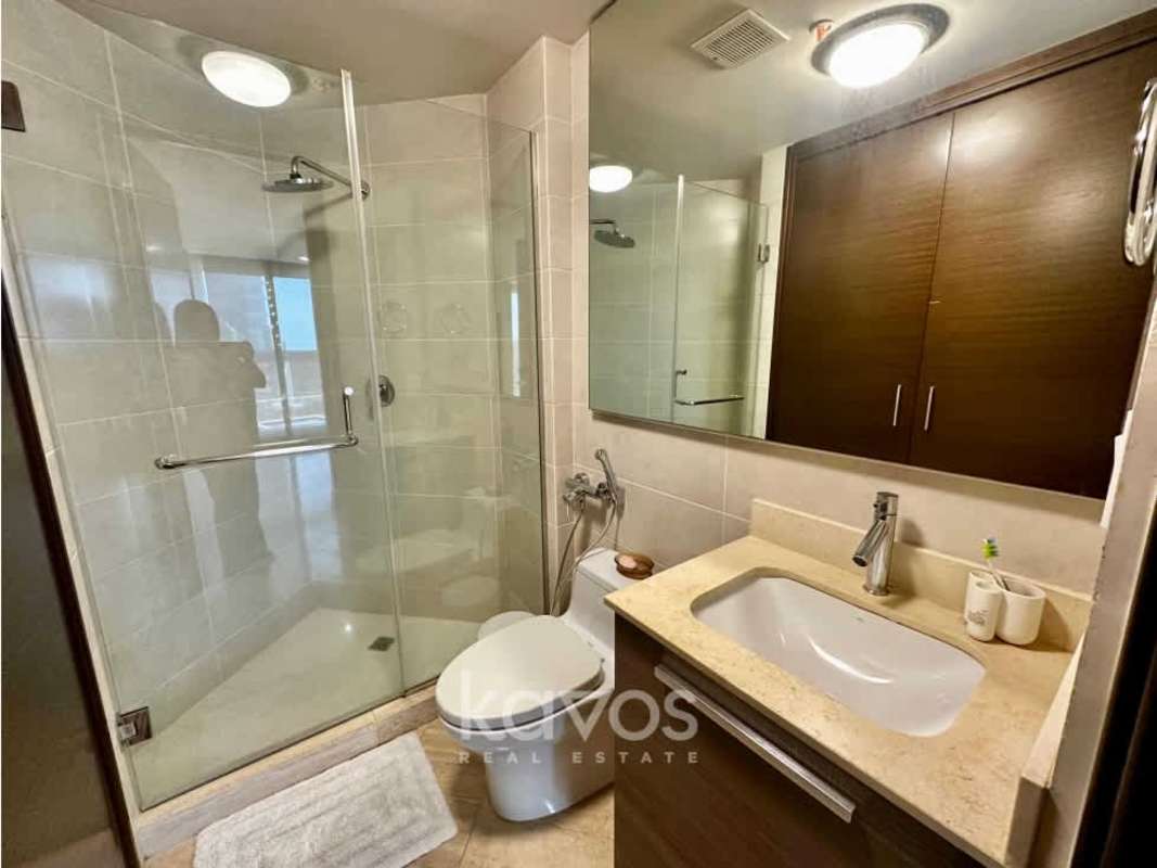 Bathroom with glass enclosed shower modern fixtures PH The Regent Panama