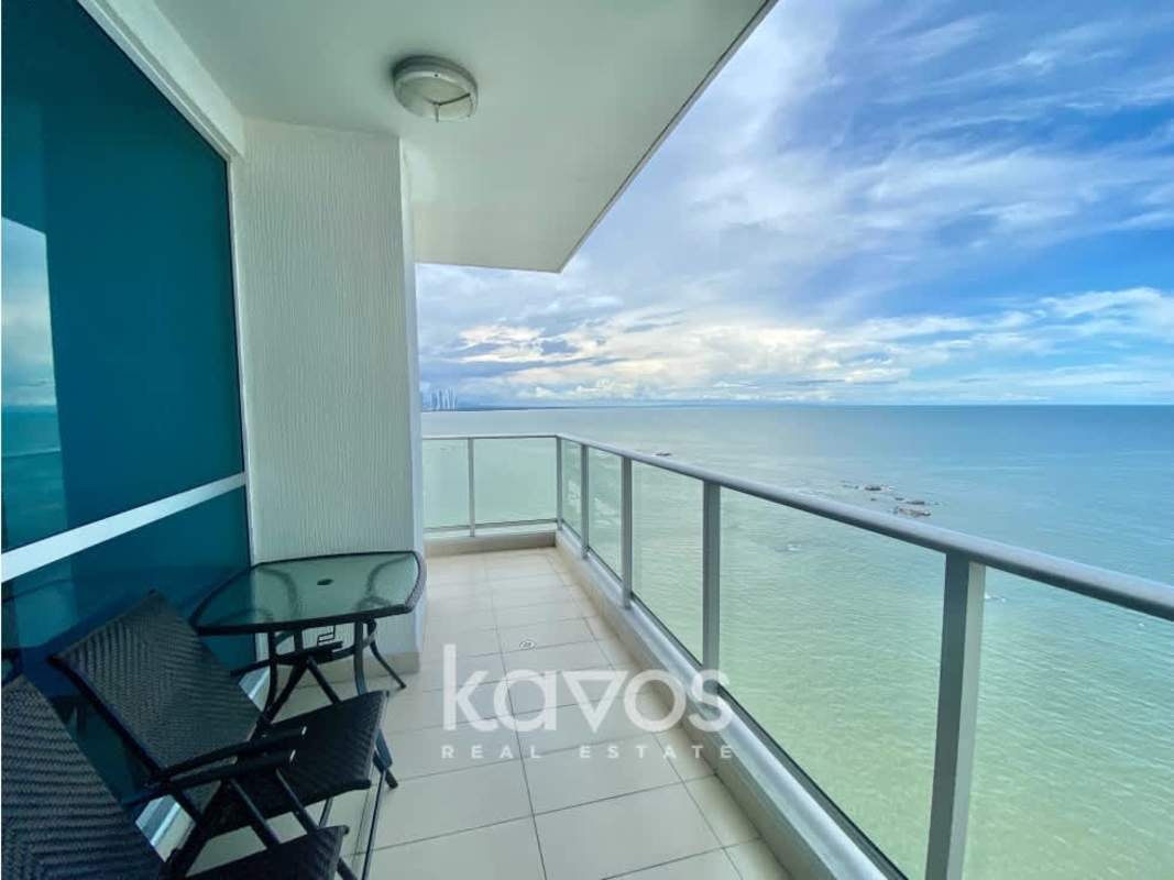 Open concept dining and living room with balcony and sea view at PH Oceanaire Punta Pacífica Panama