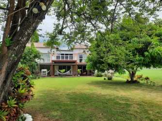Outdoor dining area on large terrace garden view villa Villas del Decameron Rio Hato Panama
