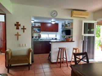 Open plan living and dining tropical style decor villa Villas del Decameron Panama beach home