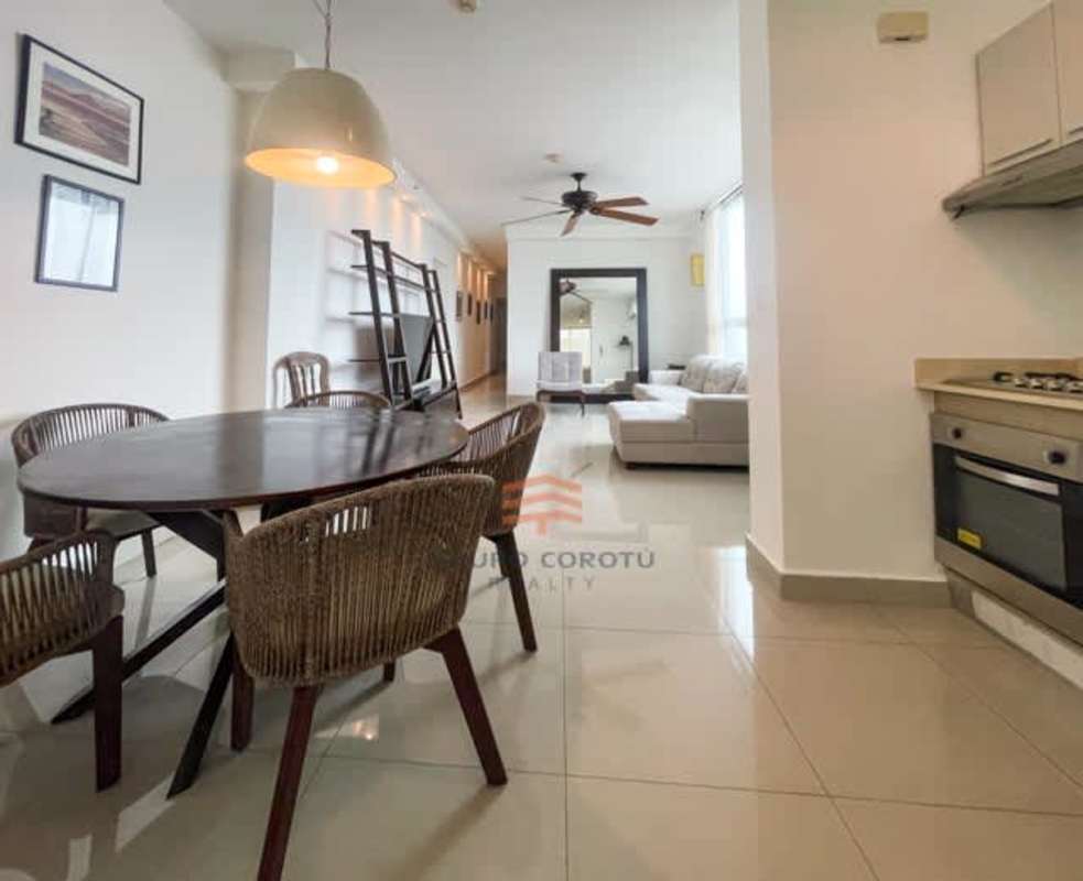 Modern kitchen with cabinetry, granite counters, appliances at PH 73 Park near Parque Omar in Panama City