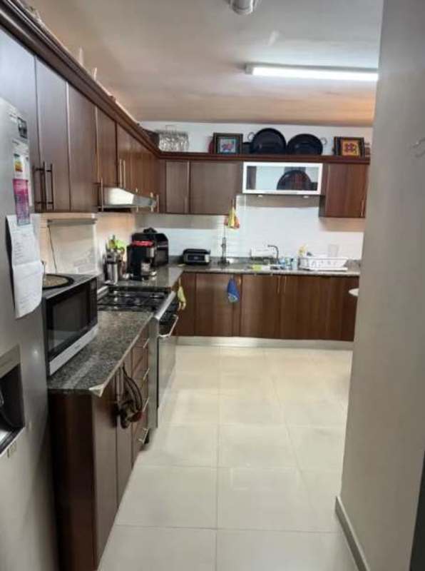 Bright living room with large windows offering city views at PH Sophia Tower Obarrio Panama