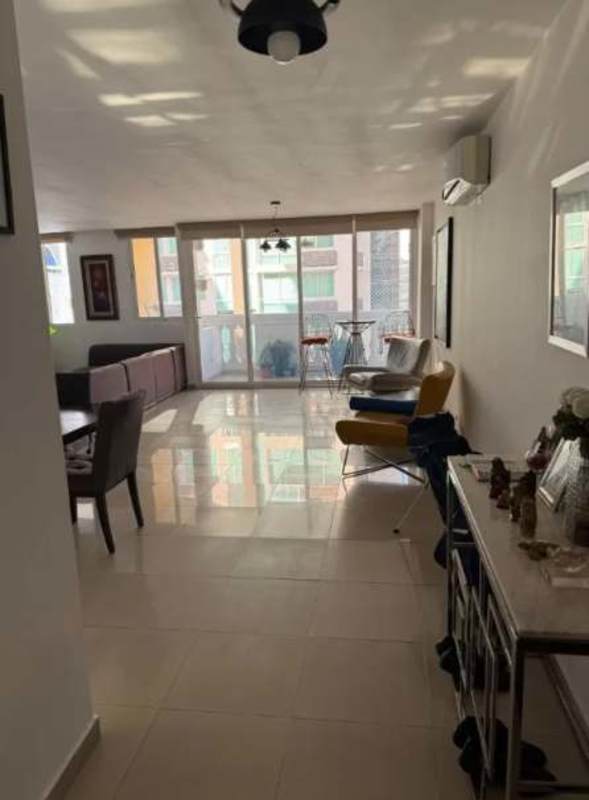 Luxury outdoor swimming pool with waterfall feature and lounge chairs at PH Sophia Tower Obarrio Panama City