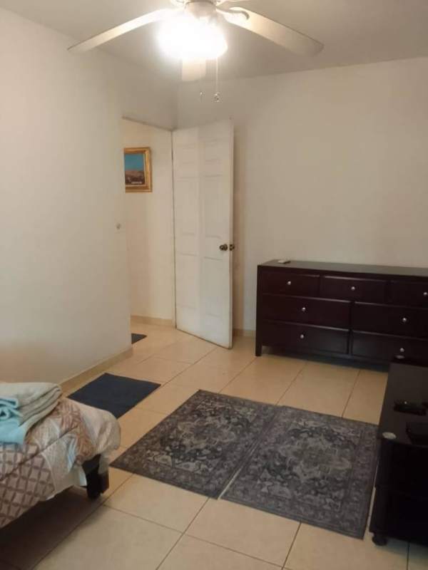 Bedroom with tile floor ceiling fan window bright light in PH Bella Vista Tower Panama City