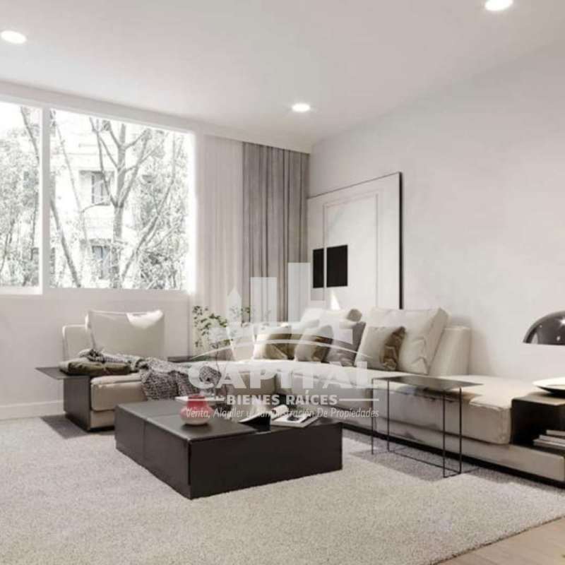 Bright minimalist living room with sectional sofa, large window, and neutral decor in PH Lemon Panama