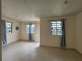 Simple bathroom tiled with walk-in shower white walls Bosque Dorado La Chorrera Panama