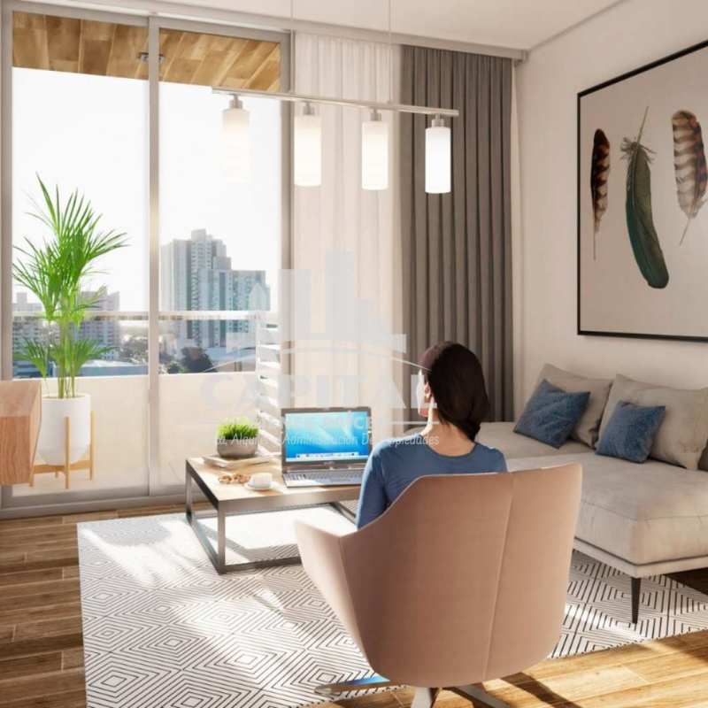 Living room with sliding glass doors to balcony overlooking Panama City at PH The Balcony