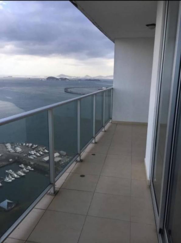 Living room with floor-to-ceiling windows and ocean views at PH White Tower Panama City