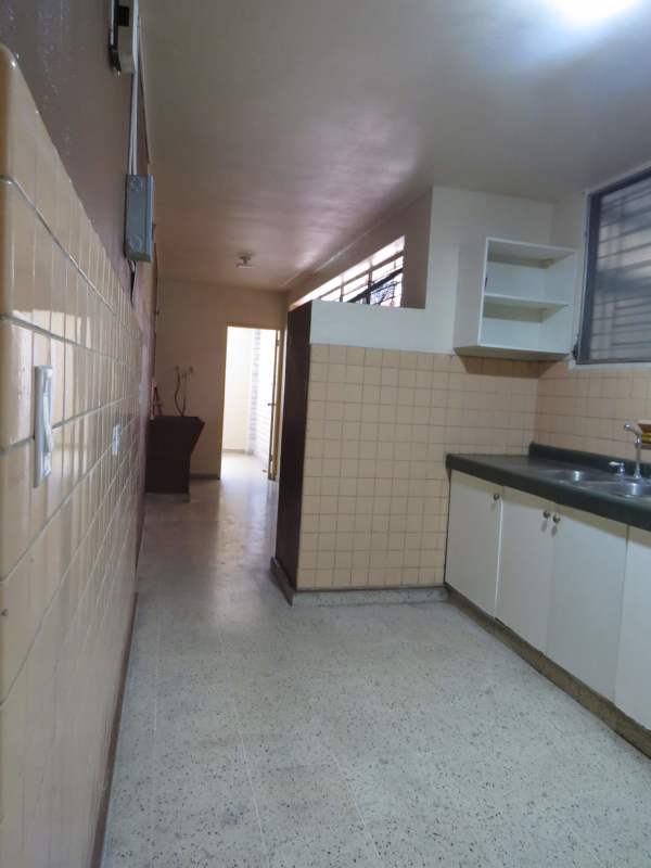 Bathroom with blue ceramic tiles, shower, and vanity in PH Comercial El Carmen Panama City