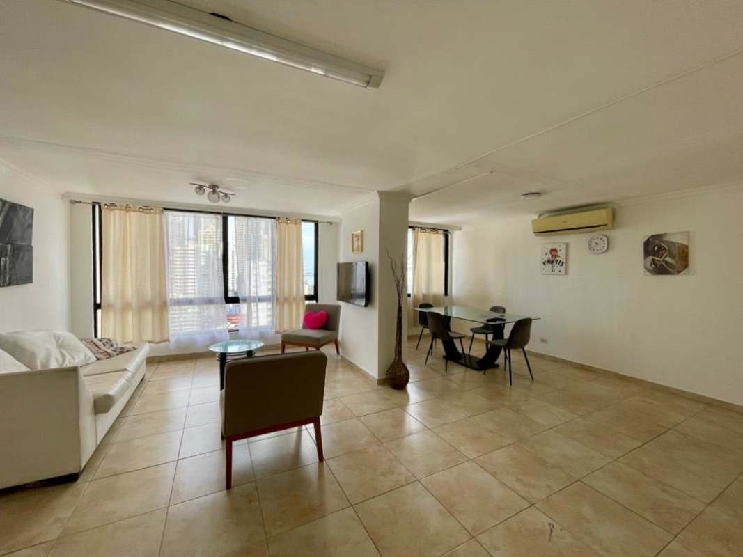 Bright living and dining room with windows, tile floors, furnished in PH Arrecife Punta Paitilla