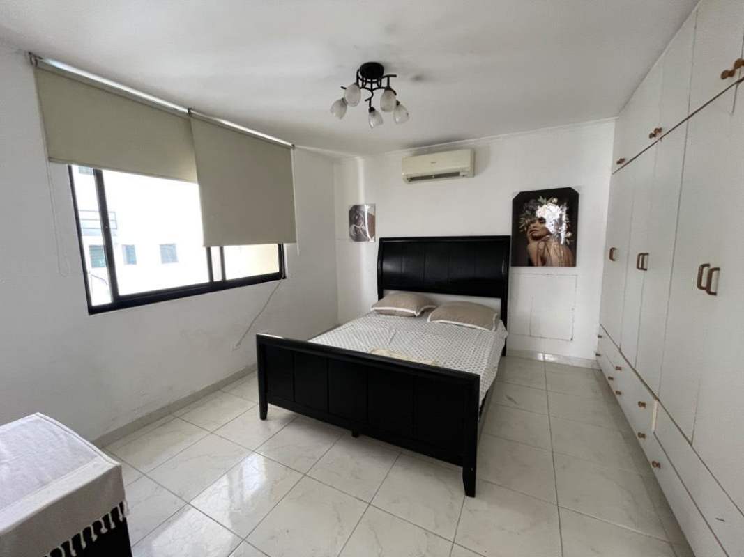 Minimalist bedroom with air conditioner and wardrobe in PH Arrecife Panama