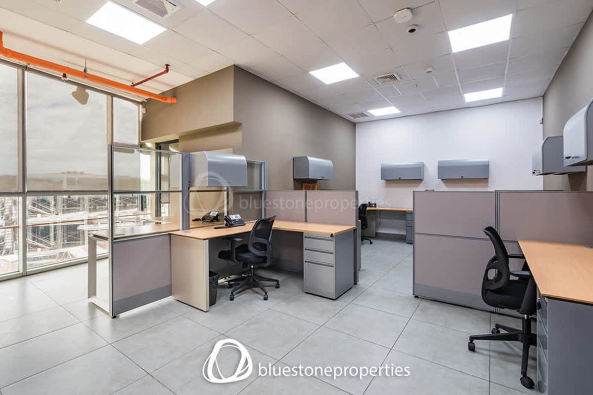 Large conference room with table, chairs, whiteboard in commercial office at Panama Viejo Business Center