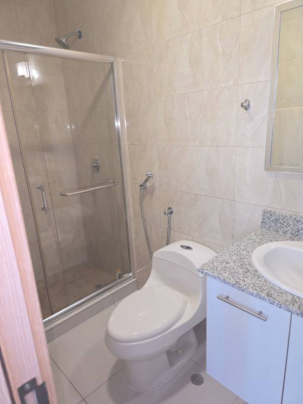 Modern gym with cardio and weight machines at PH Alcázar Panama City