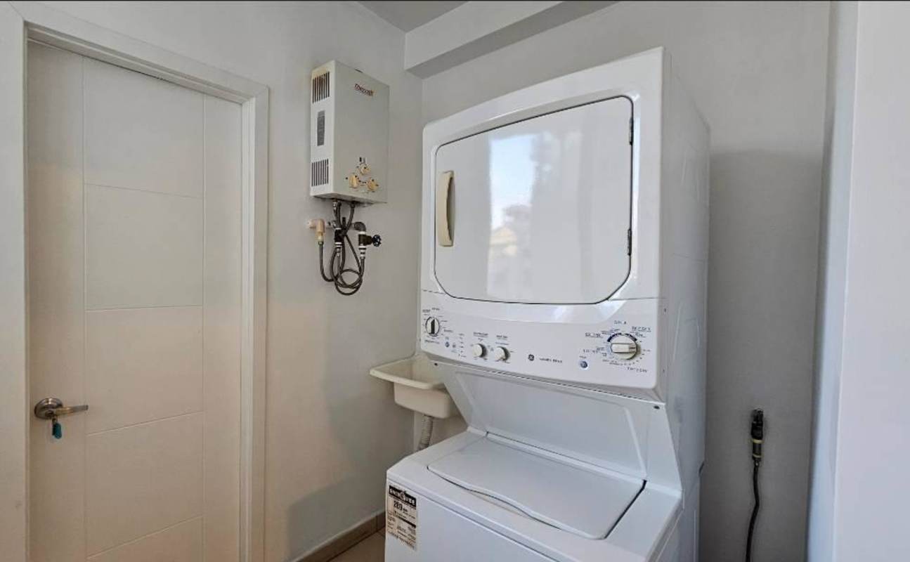 Spacious walk-in closet with wood shelving, drawers and hanging space