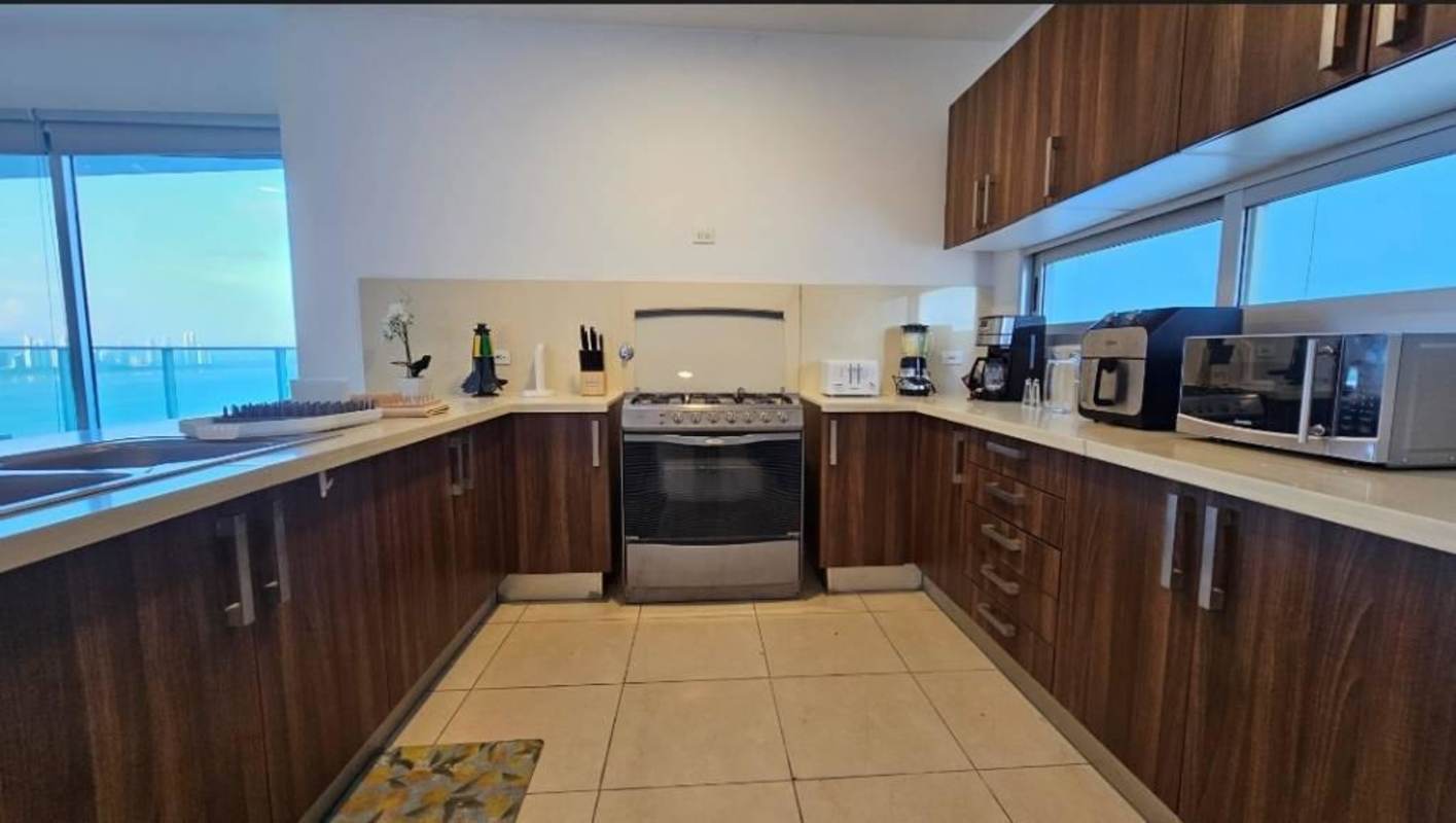 Contemporary bathroom with floating vanity, glass shower, neutral tile Punta Pacifica Panama