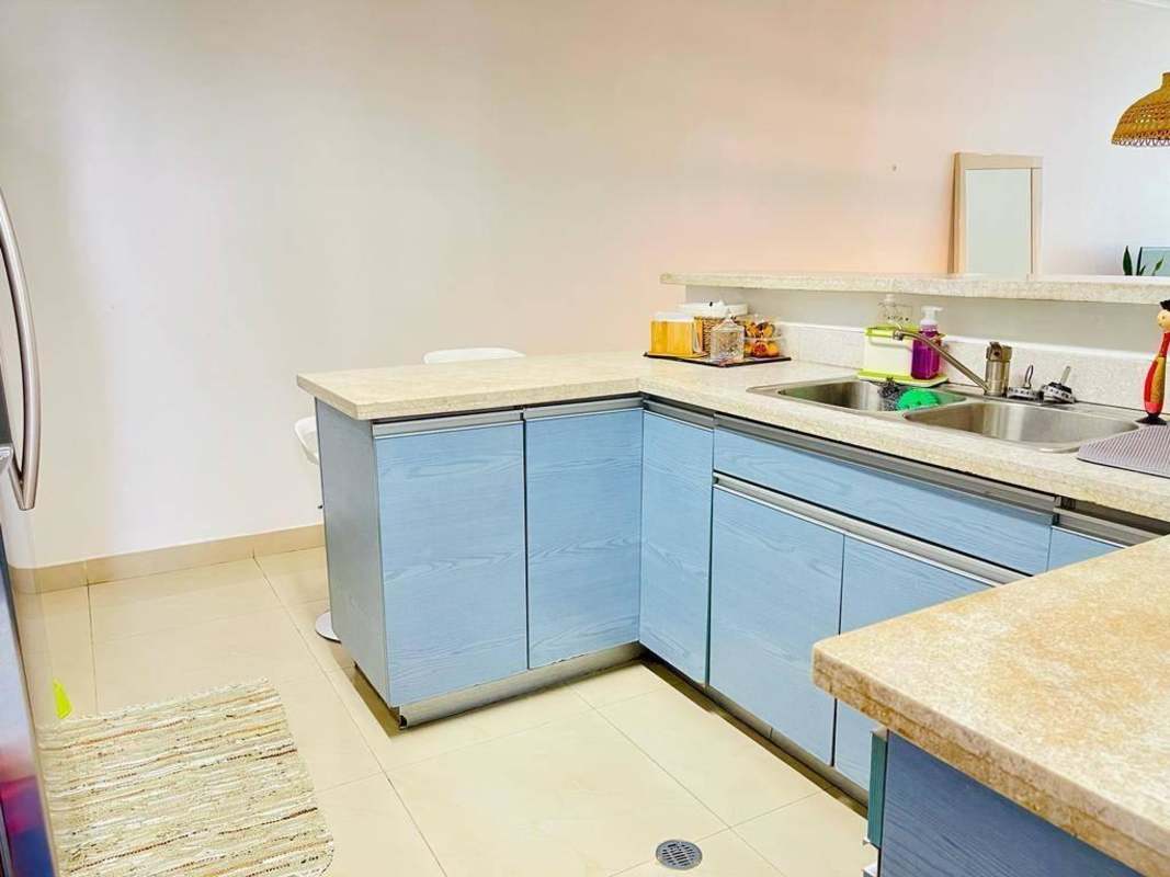 Master bedroom with large window and neutral tones at PH San Francisco Bay Panama City