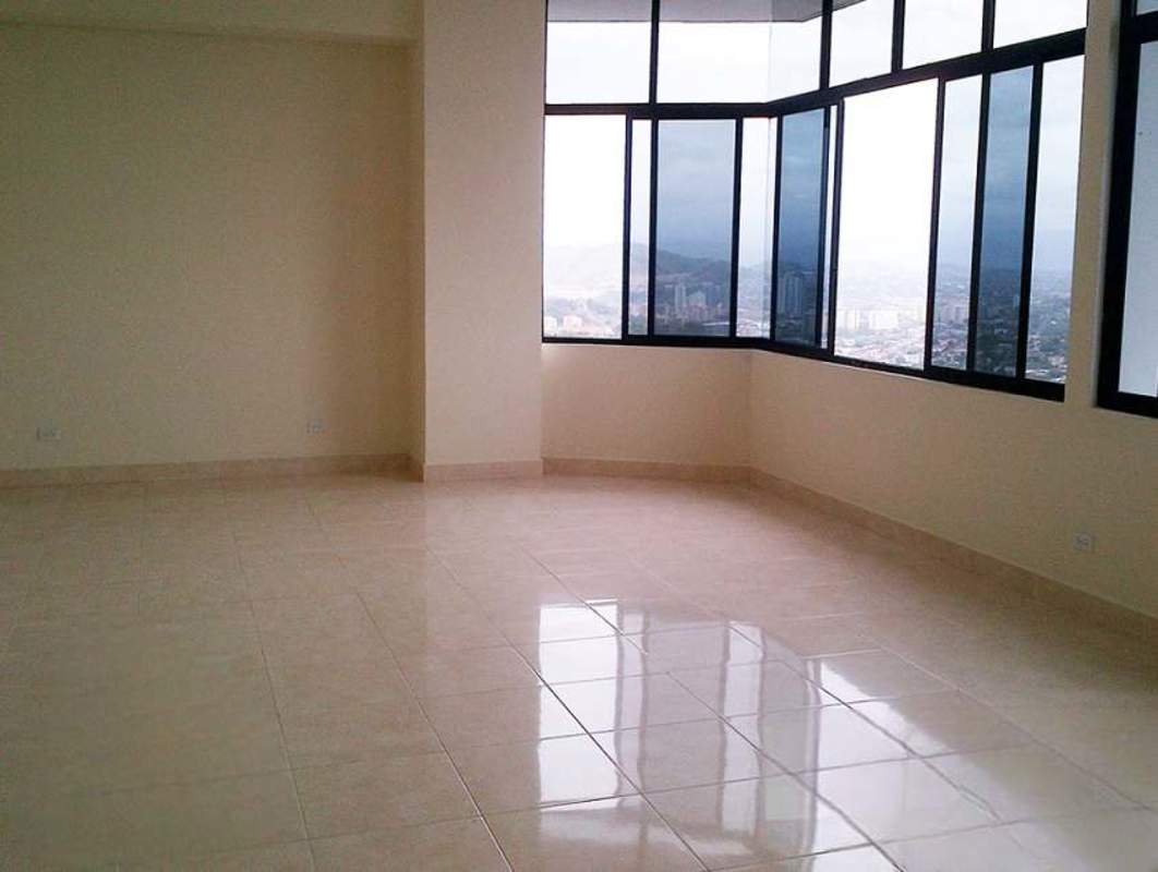 Bright living room with floor-to-ceiling corner windows panoramic views in PH Elite Panama