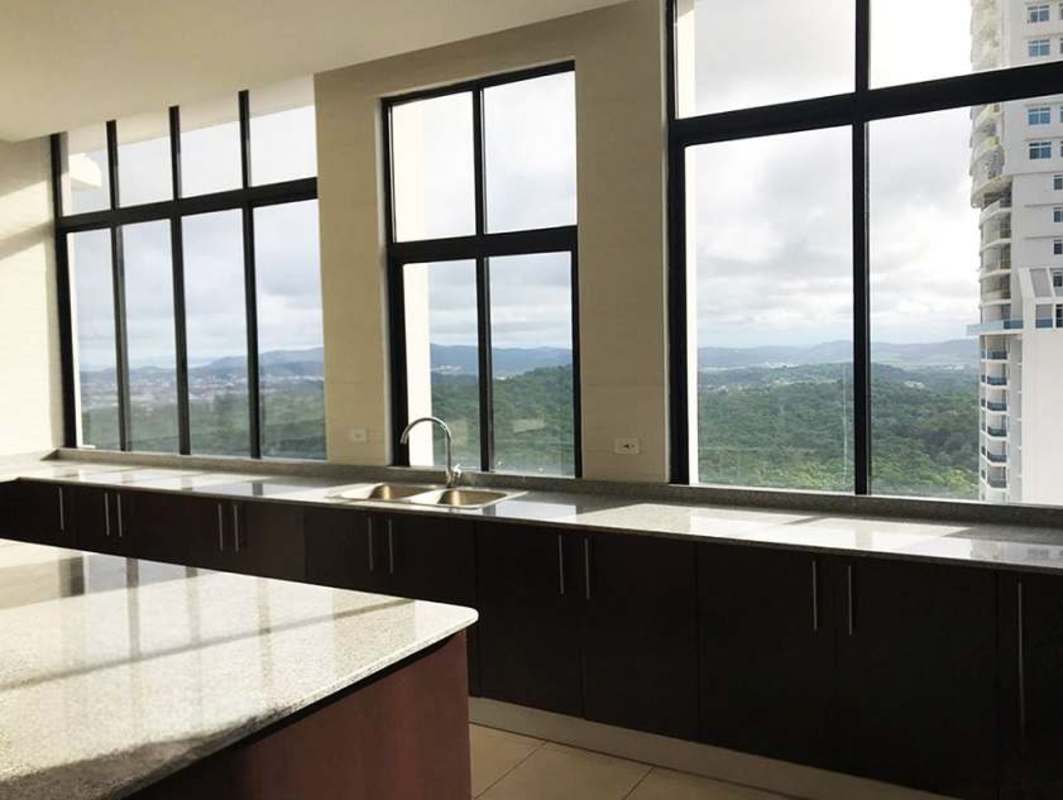 Spacious kitchen featuring granite countertops floor-to-ceiling panoramic windows with views PH Elite Dos Mares