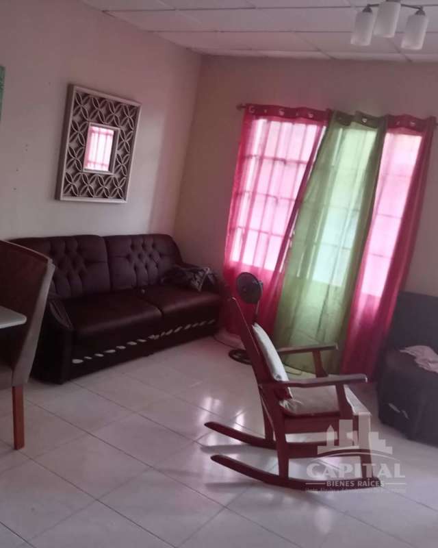 Front exterior of yellow house with porch El Crisol Panama