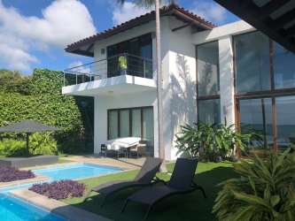 Mediterranean two-story mansion with palm trees, oceanfront Playa Coronado Panama