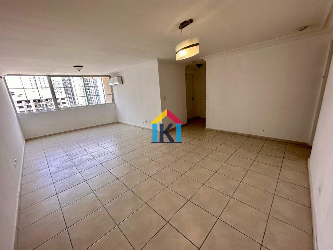 Kitchen and laundry area with wooden cabinets, large window PH Torres Mar del Sur