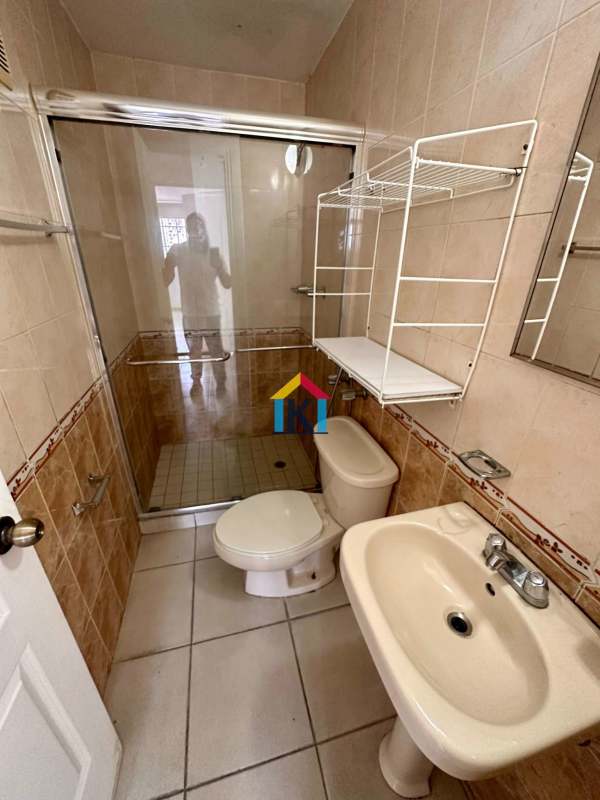 Minimalist second bathroom walk-in shower tiled PH Torres Mar del Sur Panama