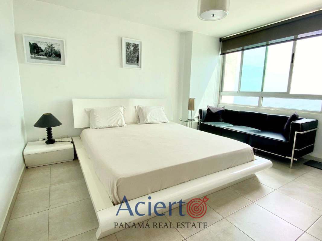 Bright bedroom with large window in furnished condo PH San Francisco Bay