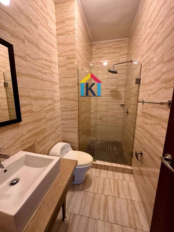 Modern kitchen with granite countertops, large window and skyline views in PH Denovo Obarrio Panama