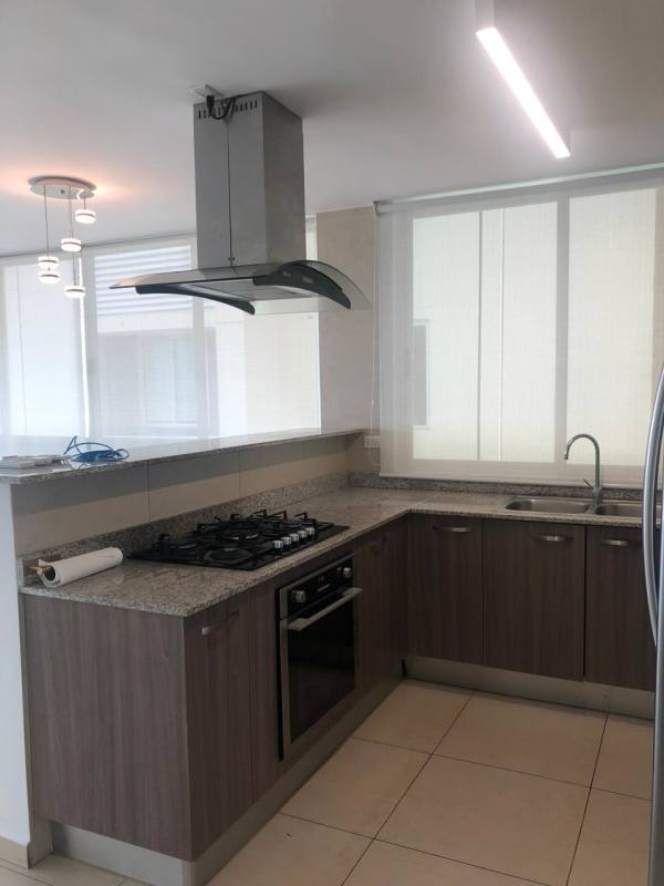 Spacious balcony with glass railing and ocean skyline view PH Lumiere Panama