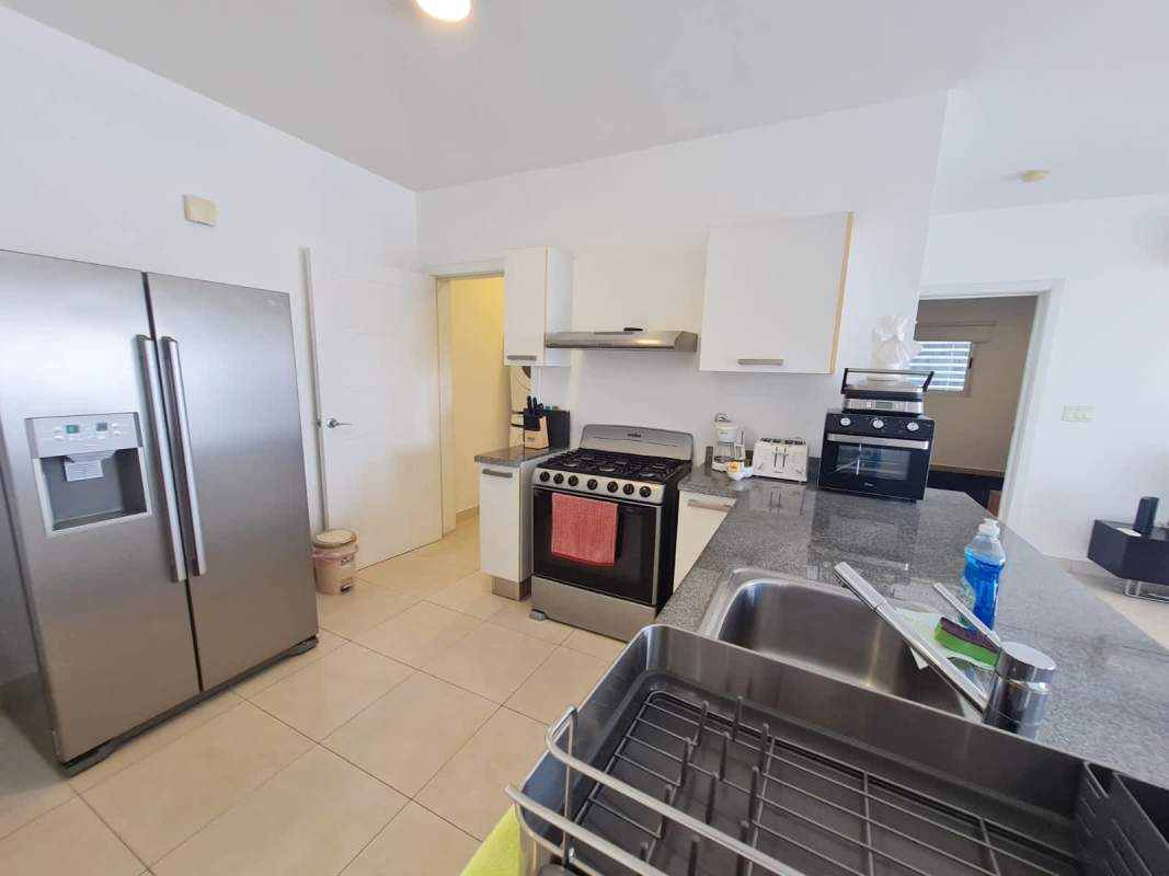 Stylish kitchen fully equipped granite counters stainless appliances PH Waters Panama City